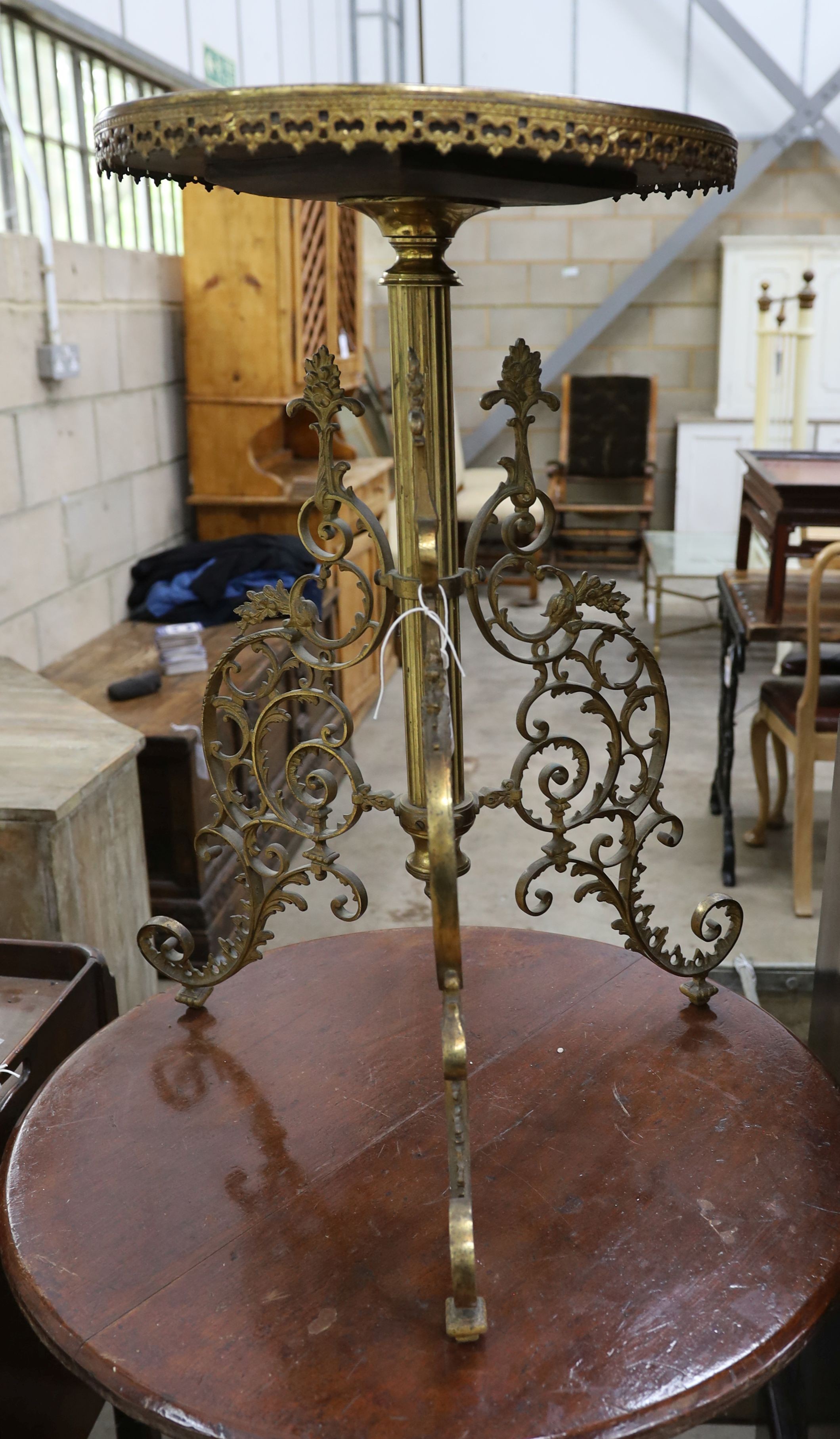 A circular brass and specimen marble tripod table, top diameter 40cm, height 71cm